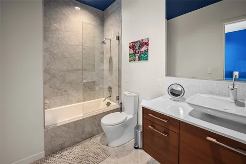 a bathroom with a sink a toilet and a bathtub