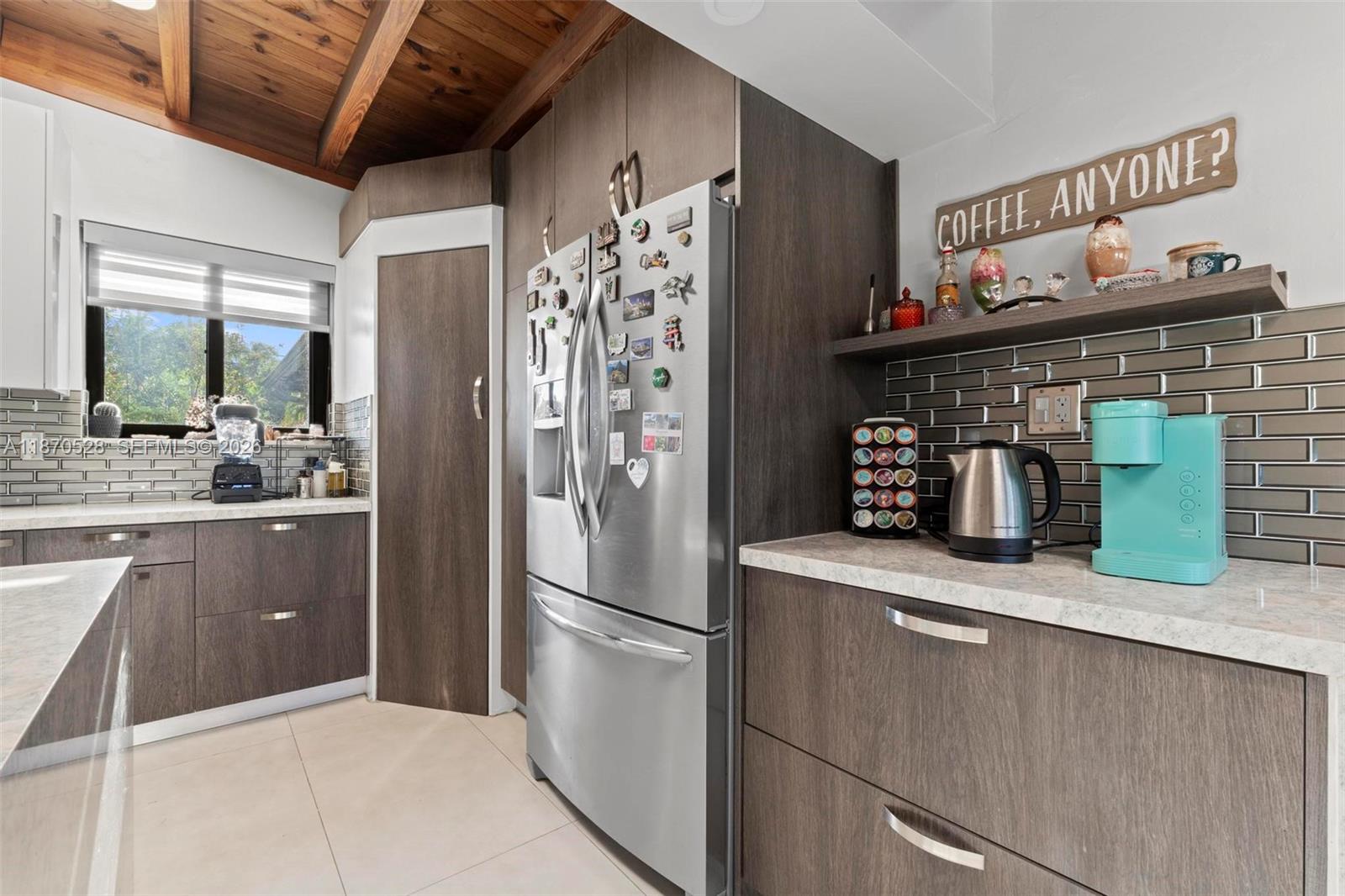 6539 Southwest 84th Avenue Miami, FL 33143 - Photo 15 of 26 a kitchen with stainless steel appliances granite countertop a refrigerator and a sink