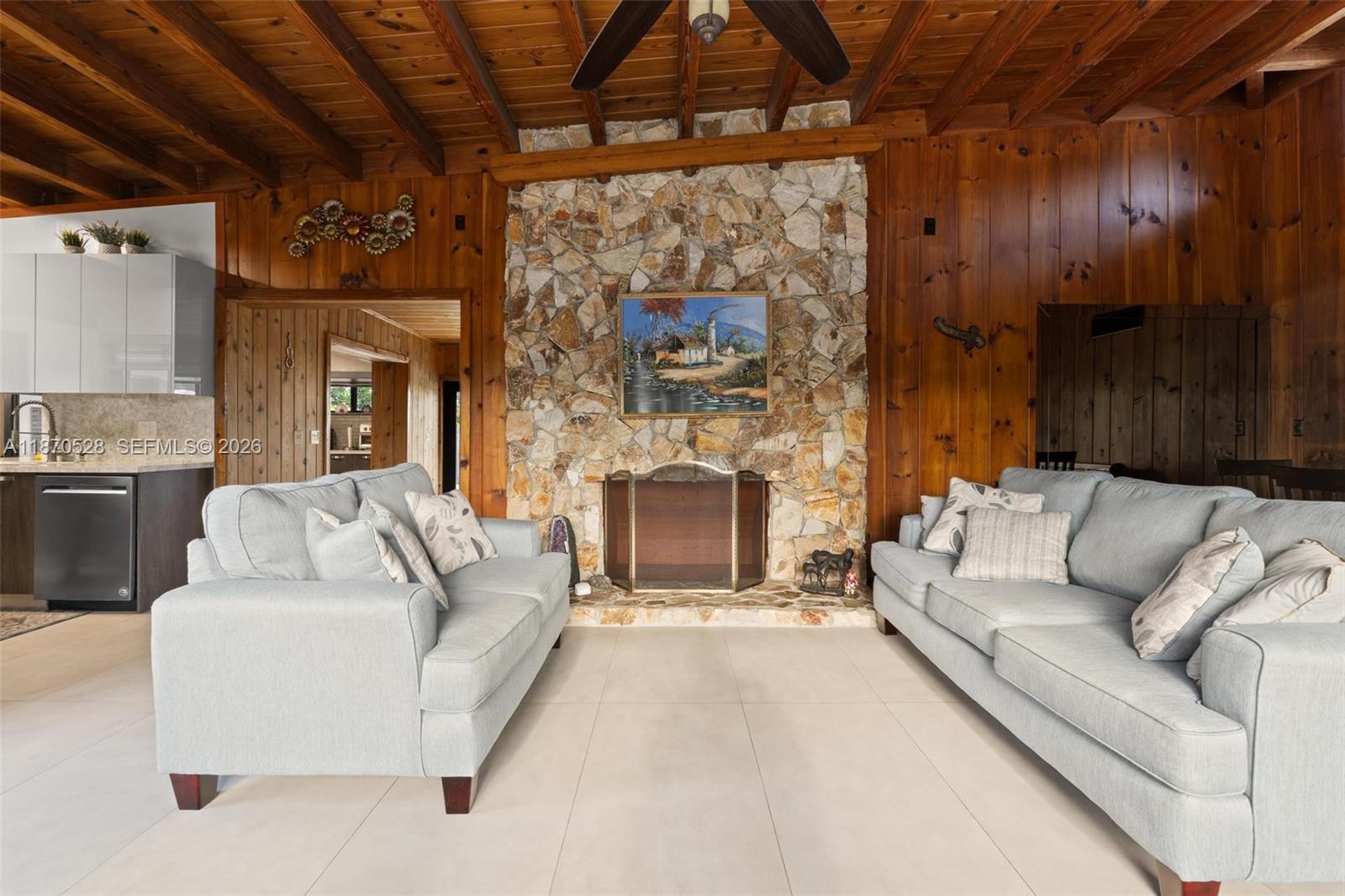 6539 Southwest 84th Avenue Miami, FL 33143 - Photo 6 of 25 a living room with furniture and a fireplace
