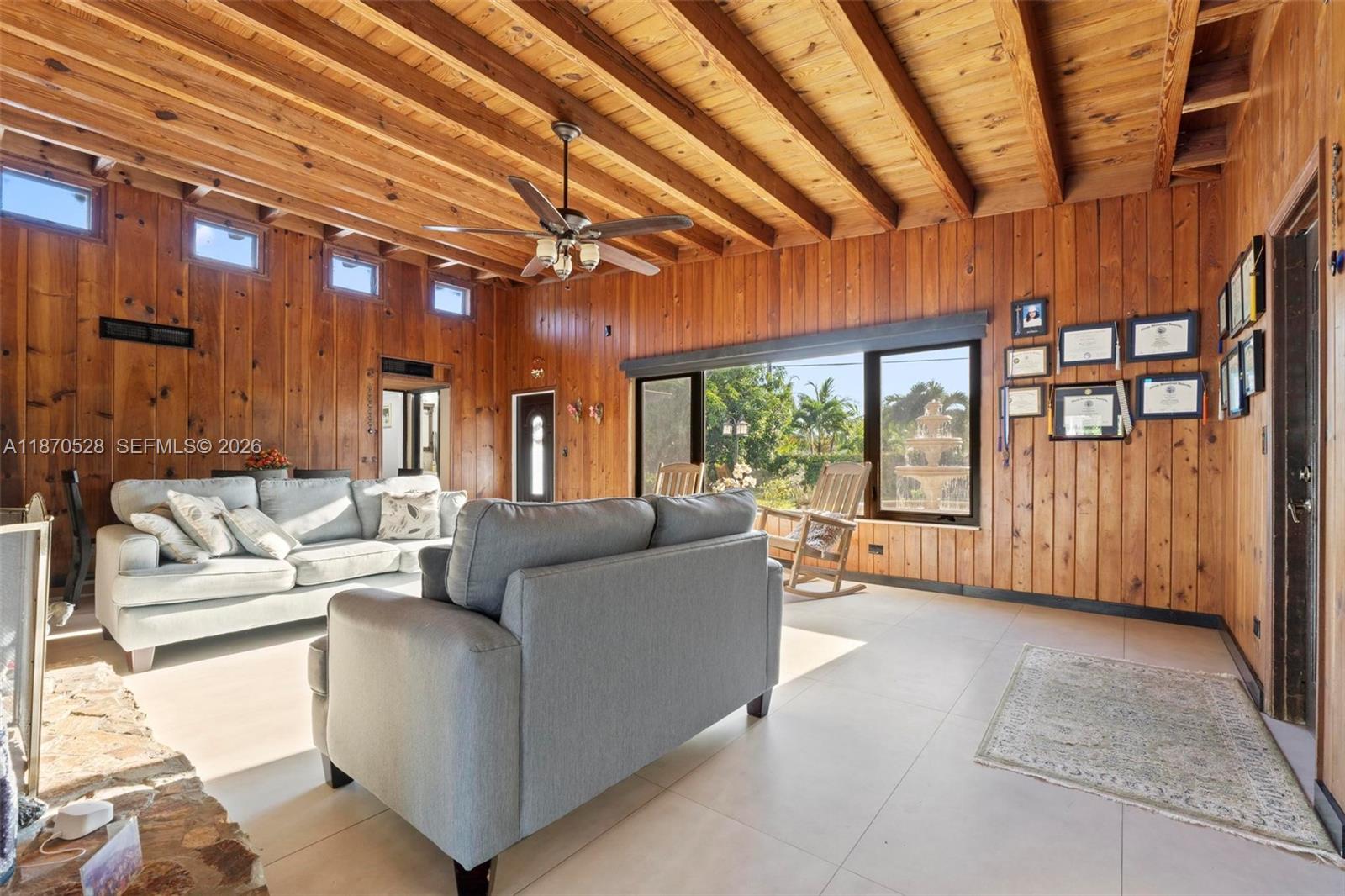 6539 Southwest 84th Avenue Miami, FL 33143 - Photo 7 of 25 a living room with furniture and a large window