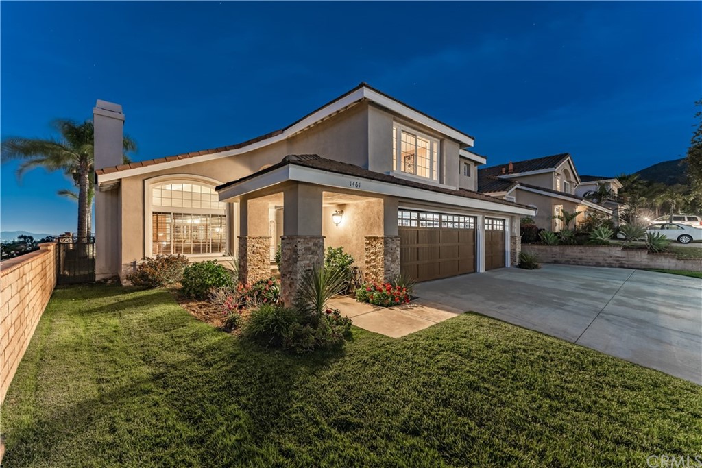 1461 Dominguez Ranch Road Corona, CA 92878 - Photo 1 of 1 a front view of a house with a yard