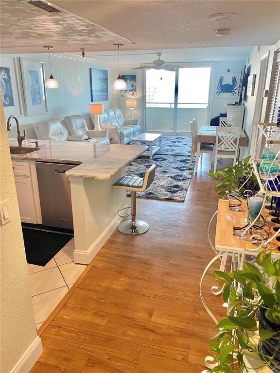 6035 Sea Ranch Drive, Unit 901 Hudson, FL 34667 - Photo 3 of 72 a living room with patio furniture and a rug