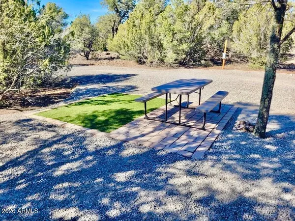 a view of a bench in a backyard