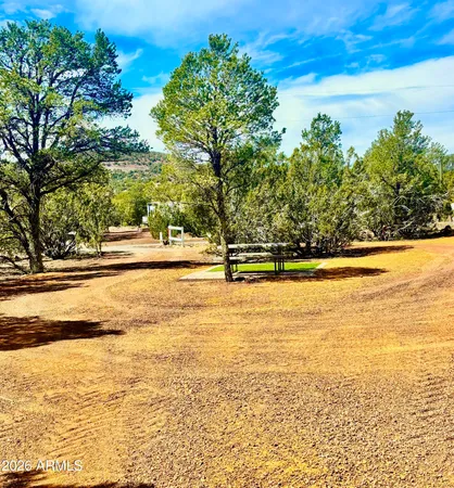 an aerial view of a house with a yard and garden