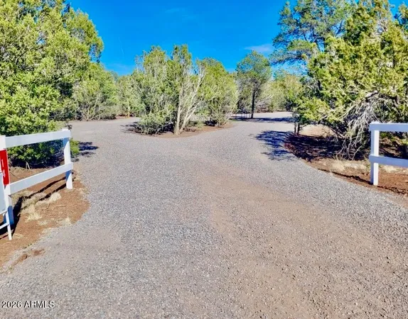 a view of street with parked cars