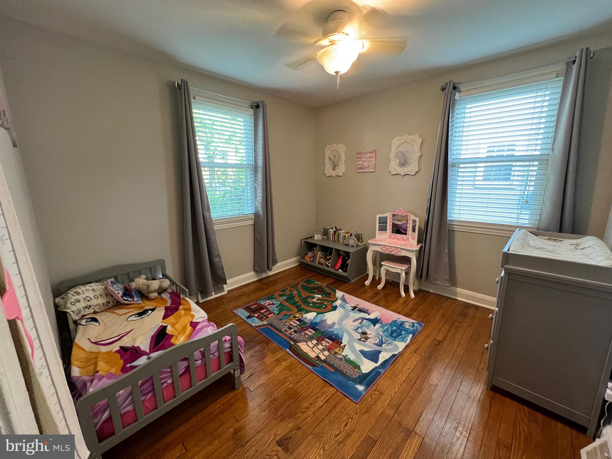 8111 Hillendale Road Baltimore, MD 21234 - Photo 11 of 21 a bed sitting in a bedroom next to a window