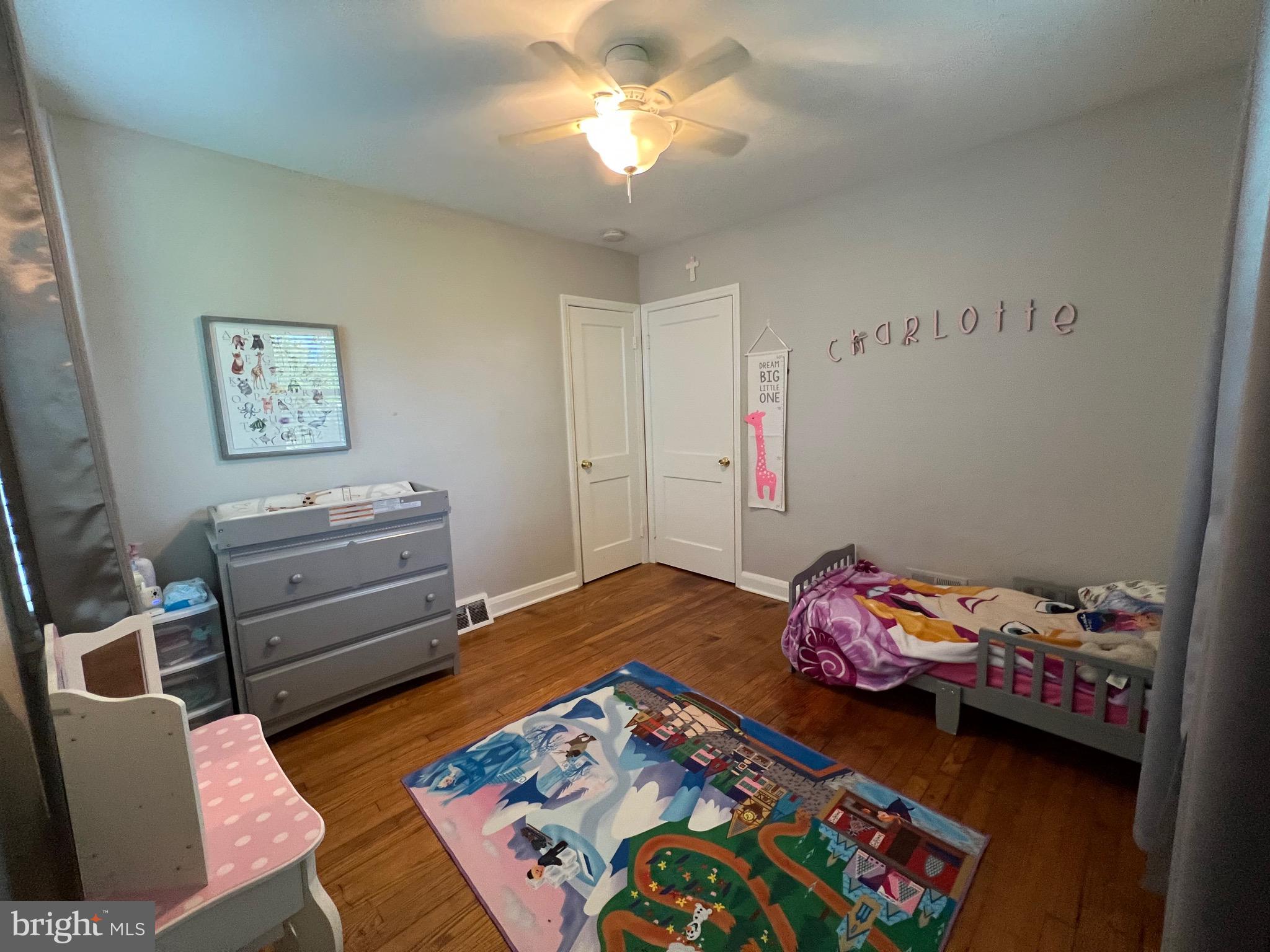8111 Hillendale Road Baltimore, MD 21234 - Photo 12 of 21 a bedroom with a bed and a wooden floor