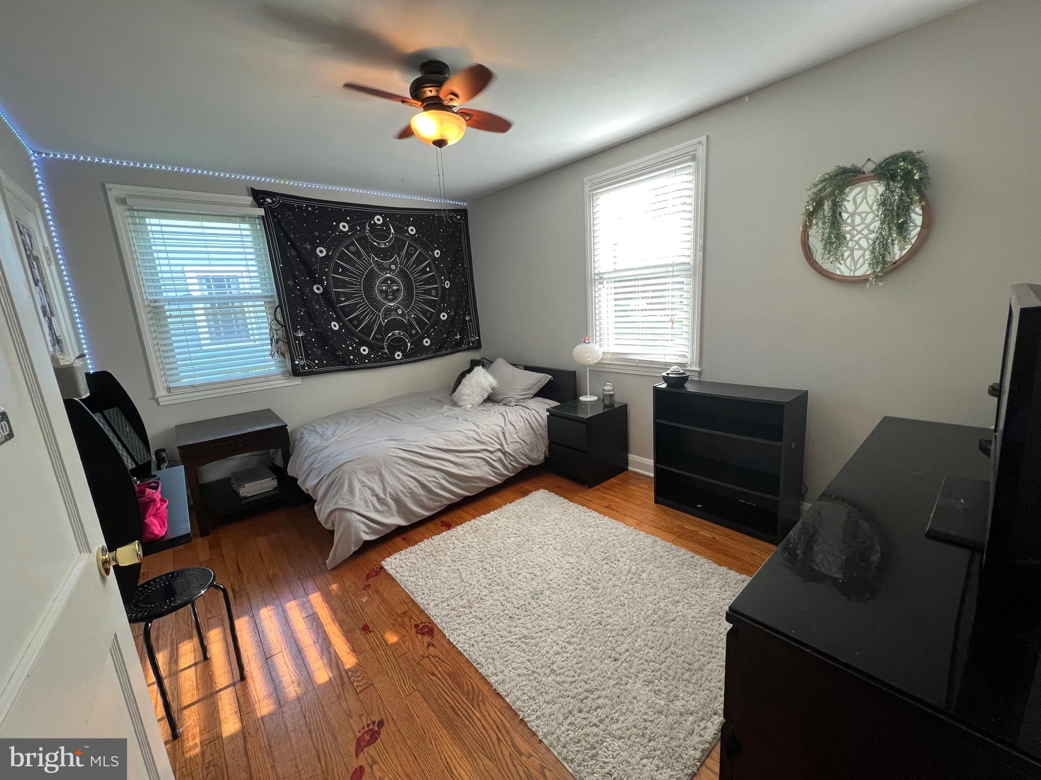 8111 Hillendale Road Baltimore, MD 21234 - Photo 14 of 21 a bedroom with a bed dresser and a window