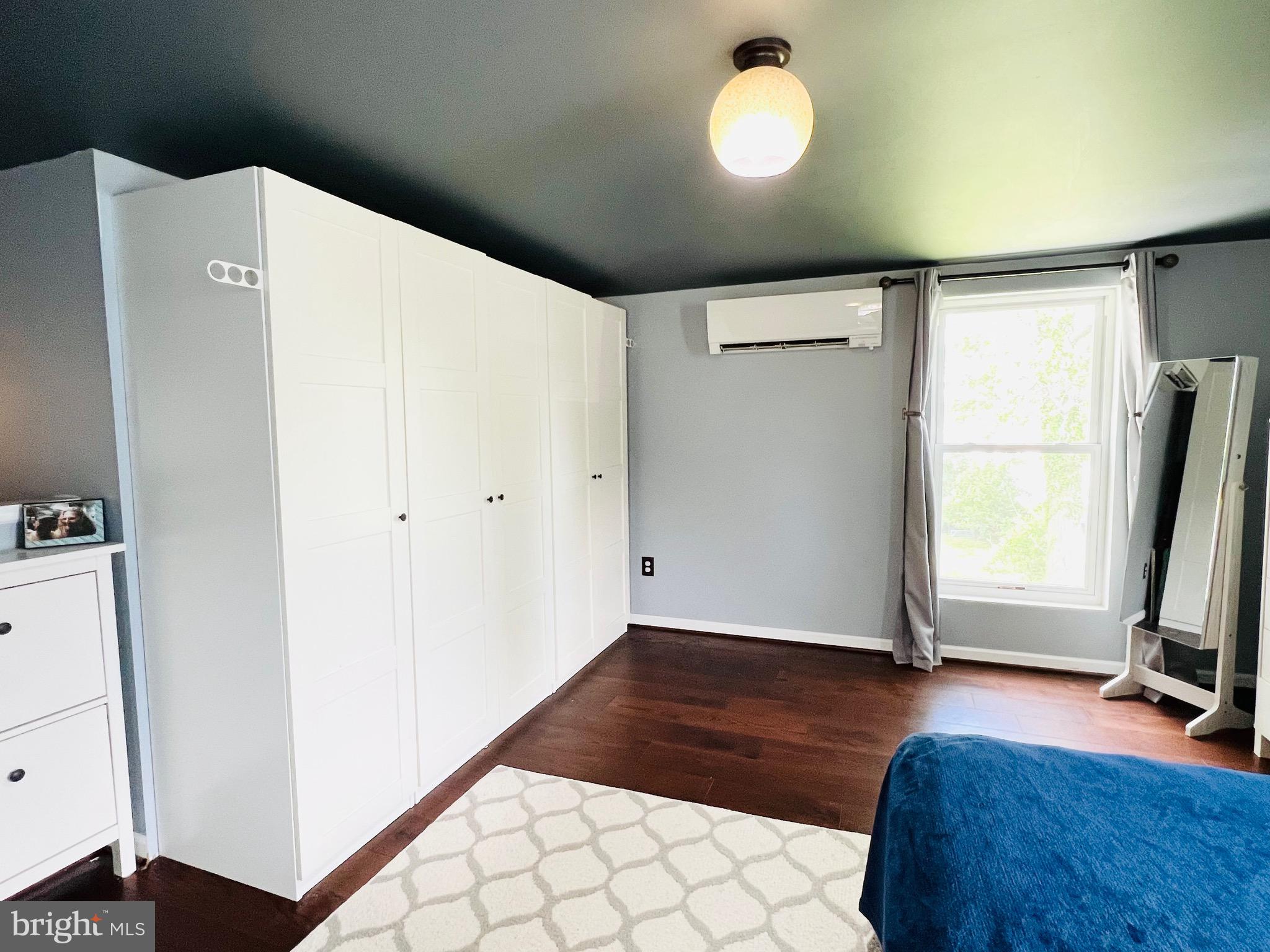 8111 Hillendale Road Baltimore, MD 21234 - Photo 19 of 21 a view of room with window and wooden floor