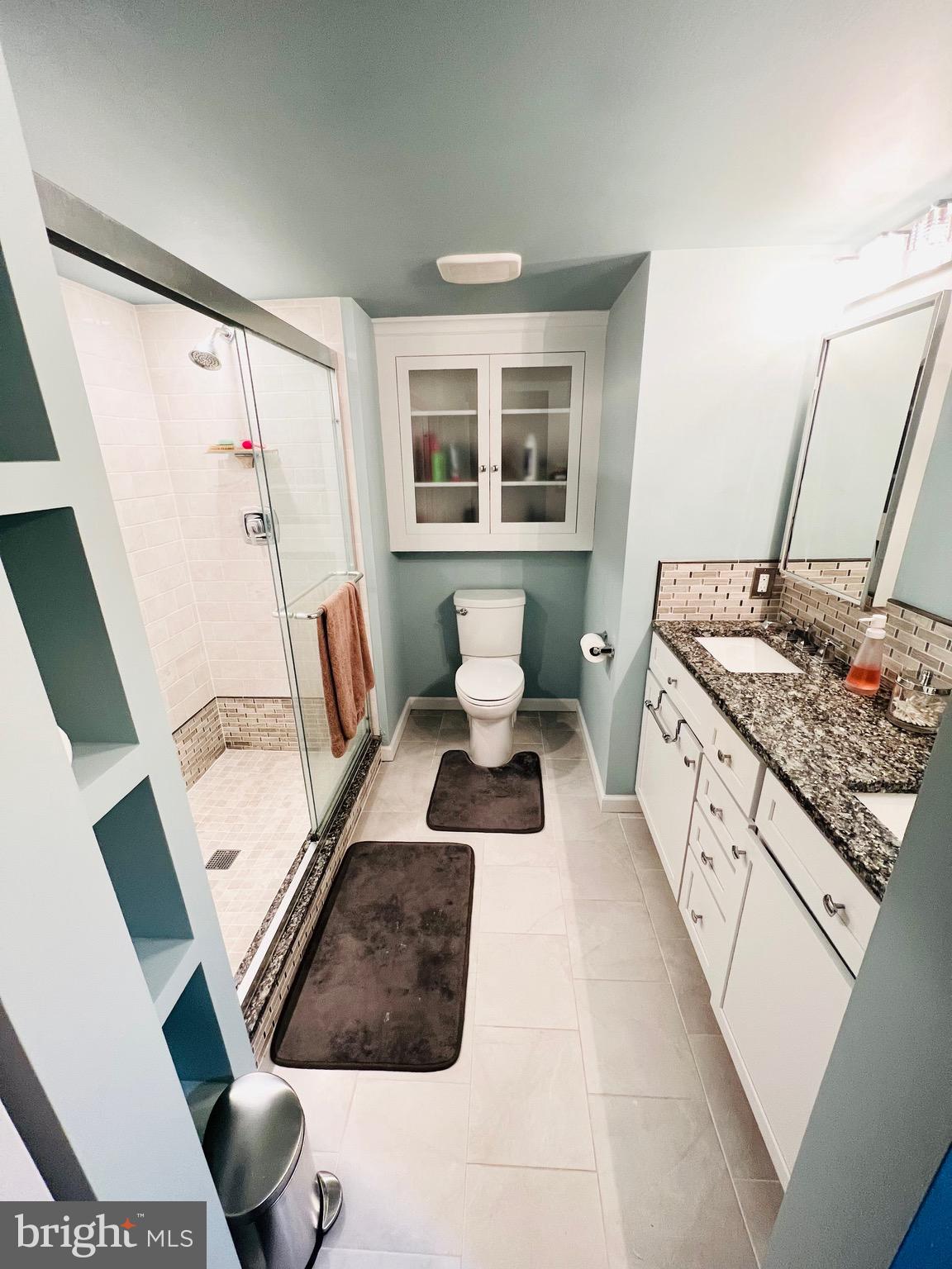 8111 Hillendale Road Baltimore, MD 21234 - Photo 20 of 21 a bathroom with a granite countertop sink and a mirror