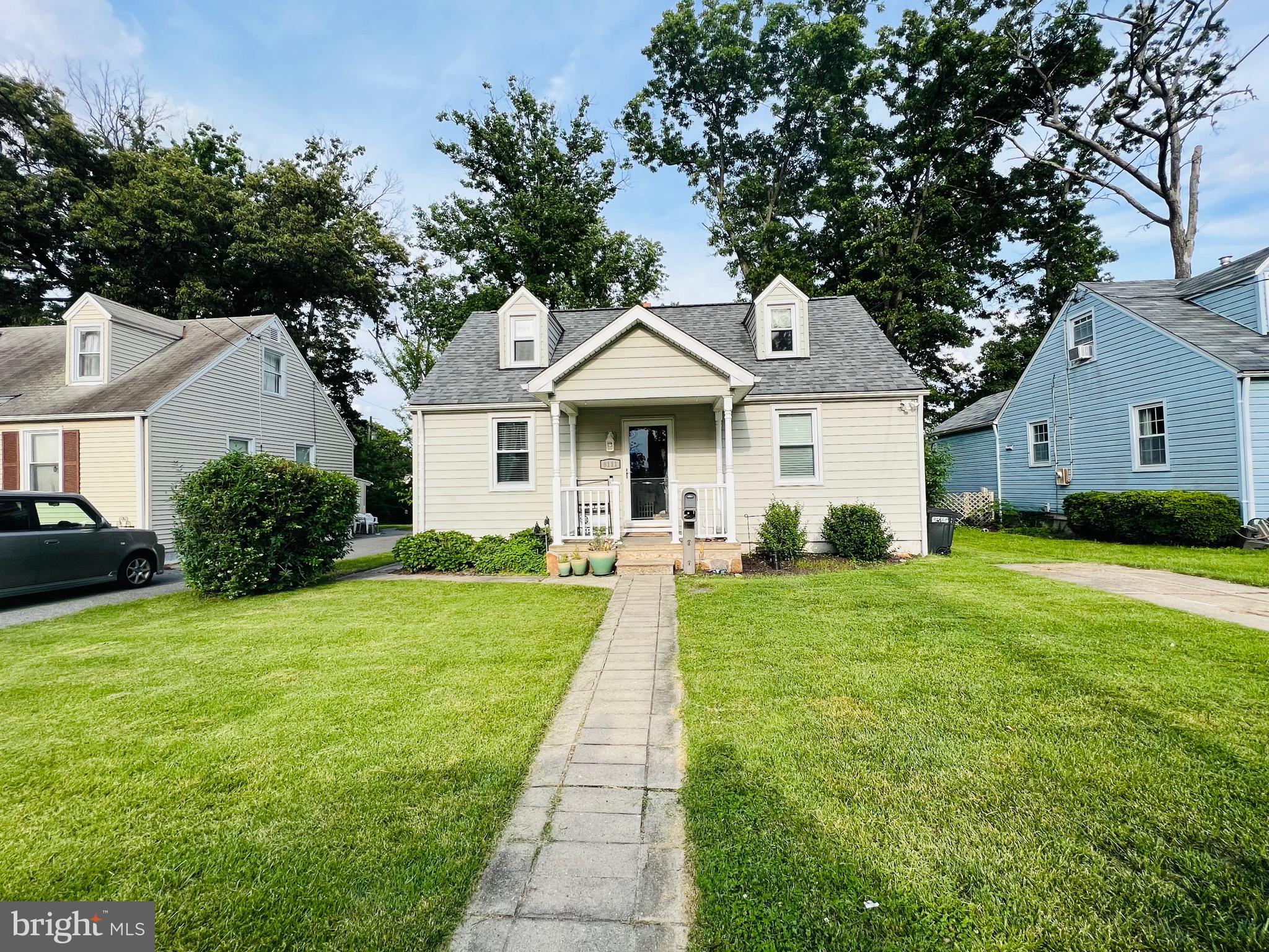 8111 Hillendale Road Baltimore, MD 21234 - Photo 2 of 21 a front view of a house with a yard