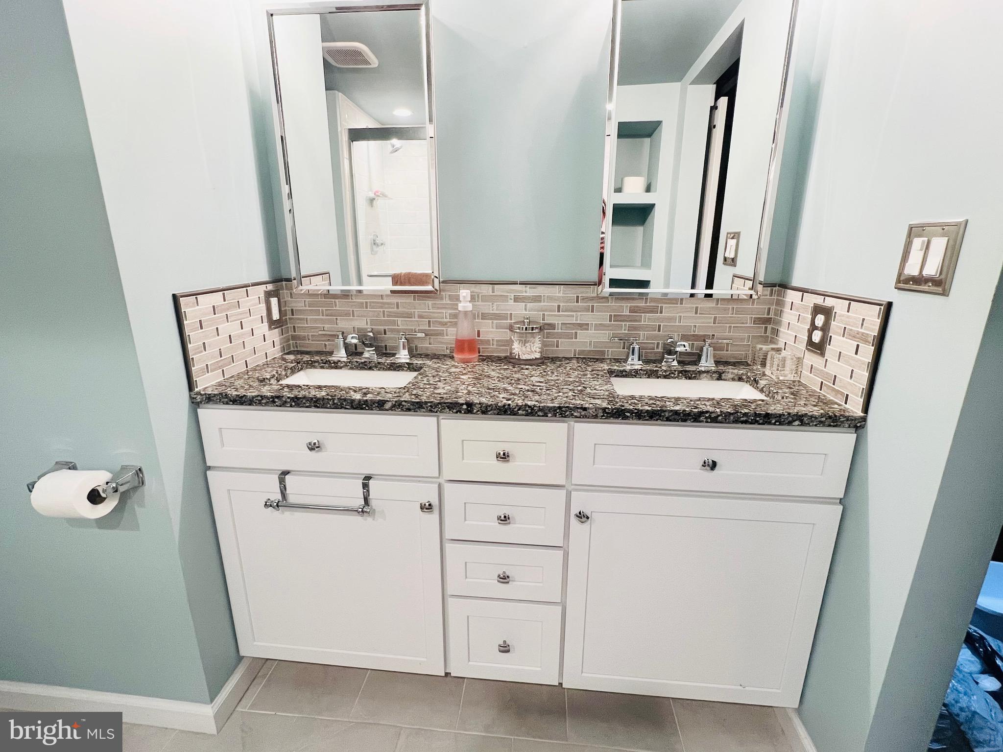 8111 Hillendale Road Baltimore, MD 21234 - Photo 21 of 21 a bathroom with a granite countertop sink and a mirror