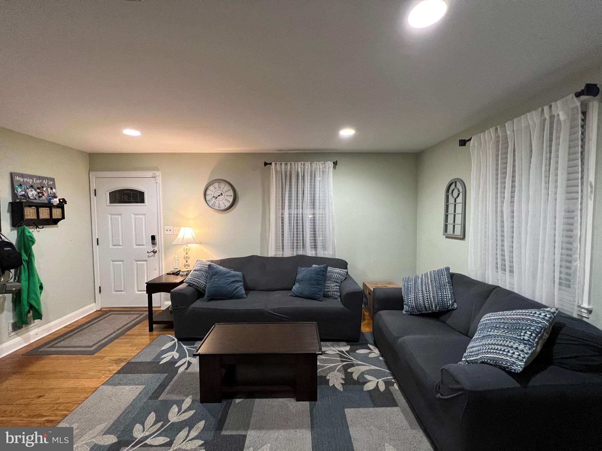 8111 Hillendale Road Baltimore, MD 21234 - Photo 4 of 21 a living room with furniture and a couch