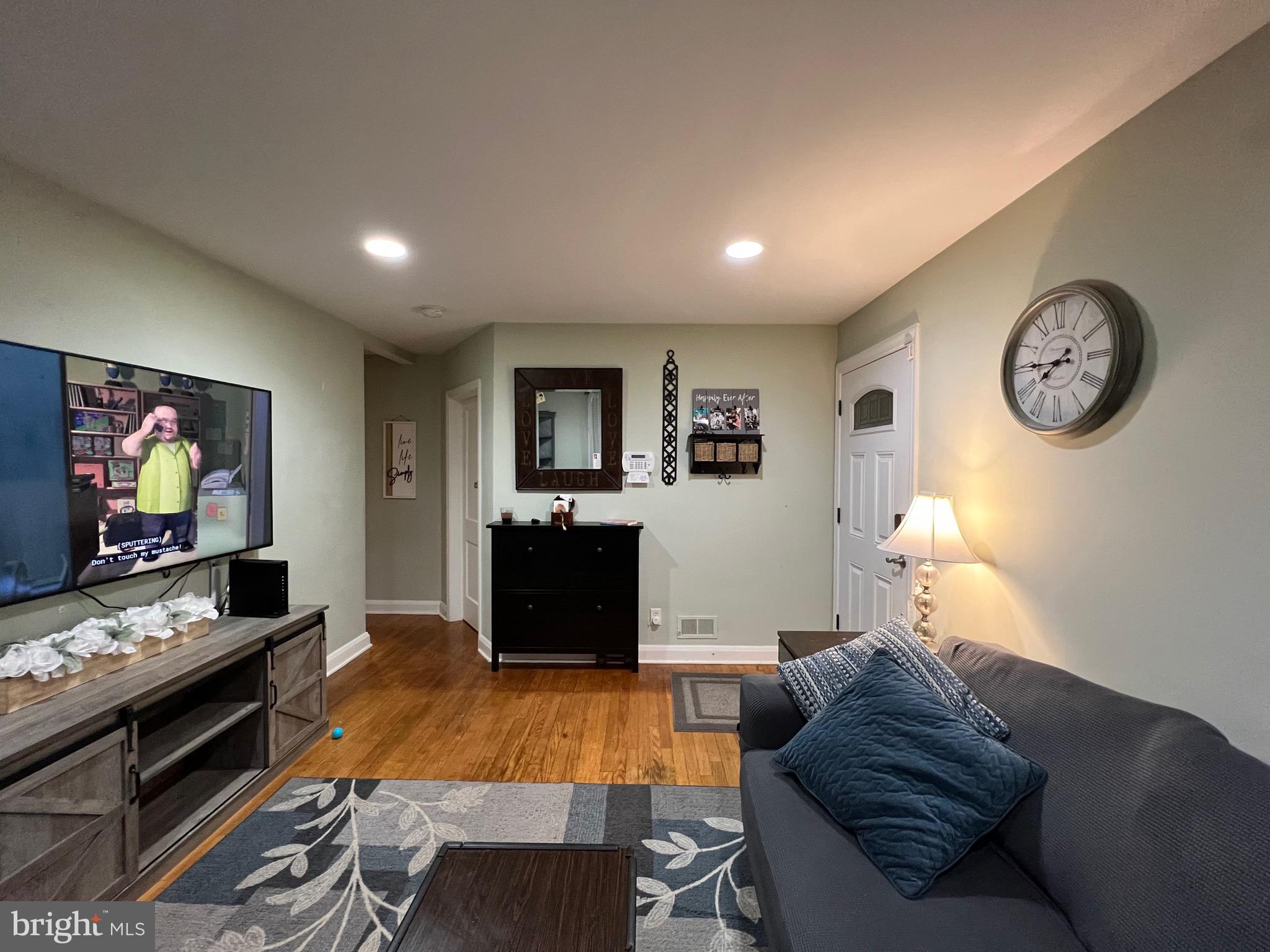 8111 Hillendale Road Baltimore, MD 21234 - Photo 5 of 21 a living room with furniture and a flat screen tv