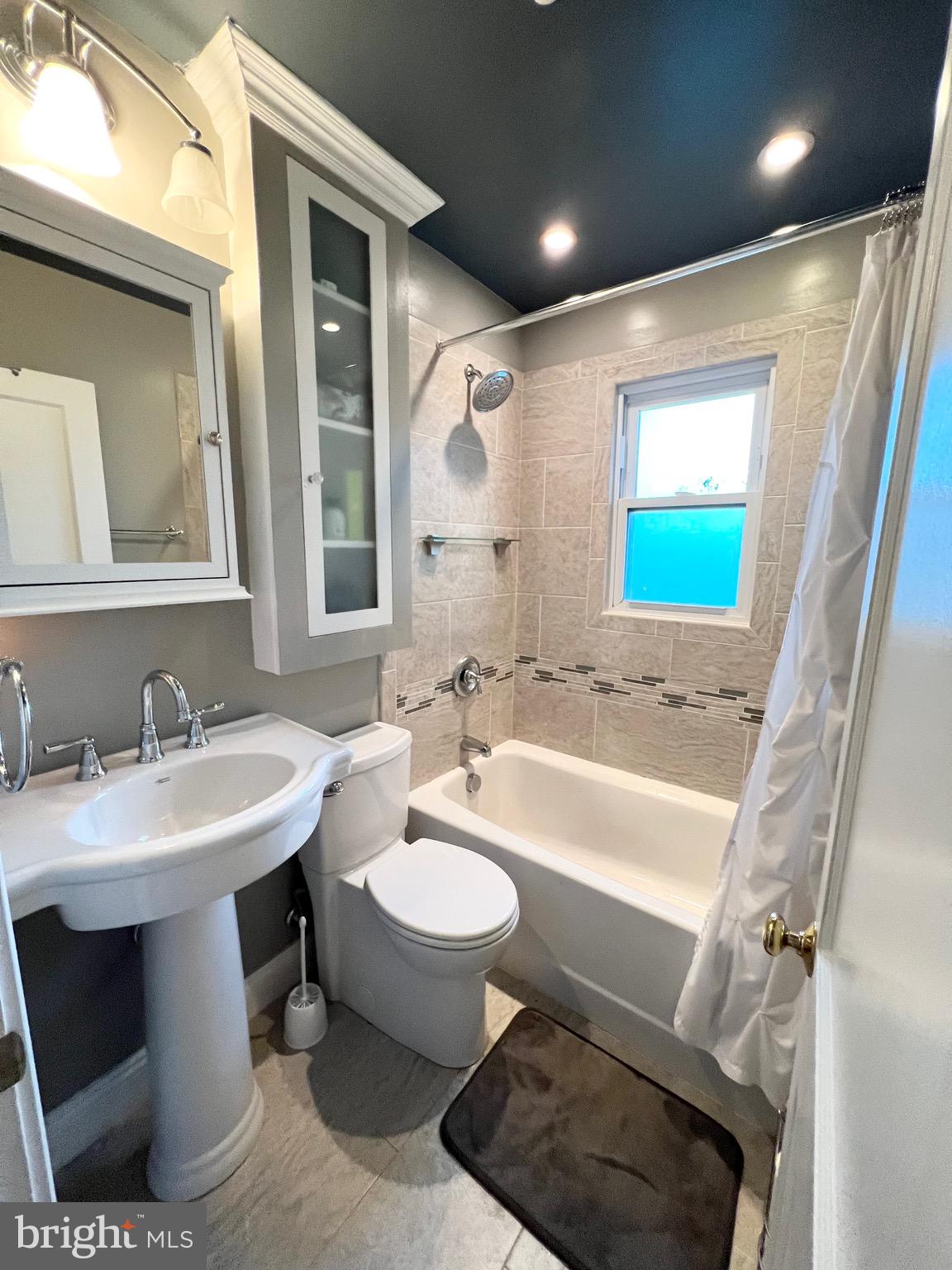8111 Hillendale Road Baltimore, MD 21234 - Photo 6 of 21 a bathroom with a sink and a mirror