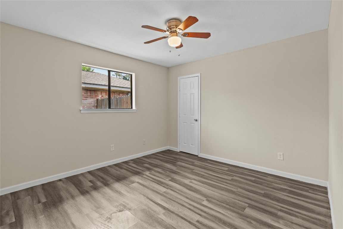 5026 Fitzwater Drive Spring, TX 77373 - Photo 11 of 14 wooden floor in an empty room with a window