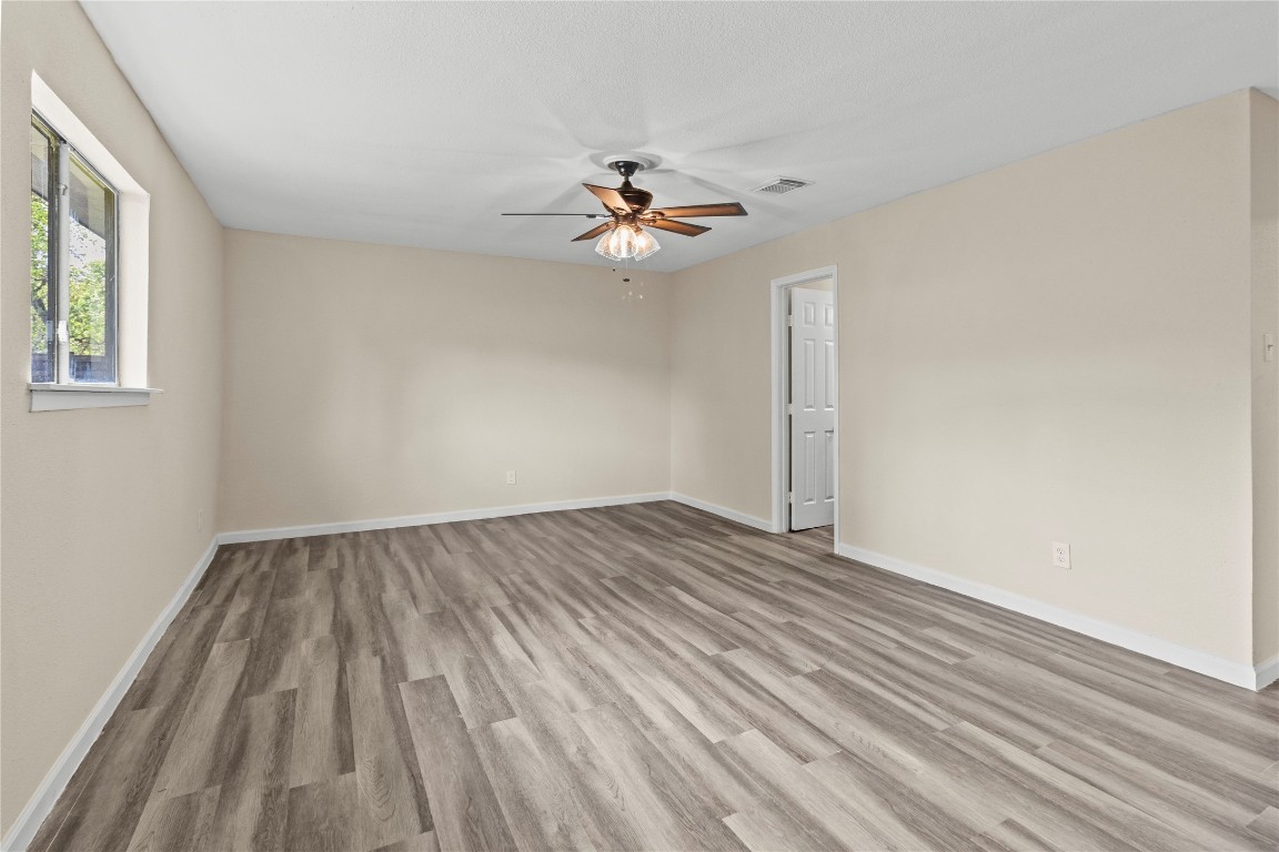 5026 Fitzwater Drive Spring, TX 77373 - Photo 12 of 14 wooden floor in an empty room with a window