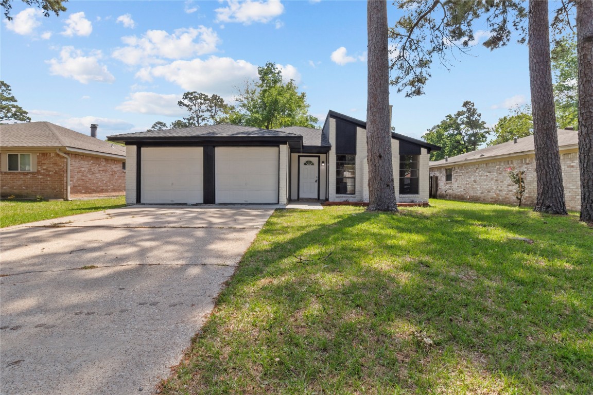 5026 Fitzwater Drive Spring, TX 77373 - Photo 3 of 14 a view of a house with a yard and large tree
