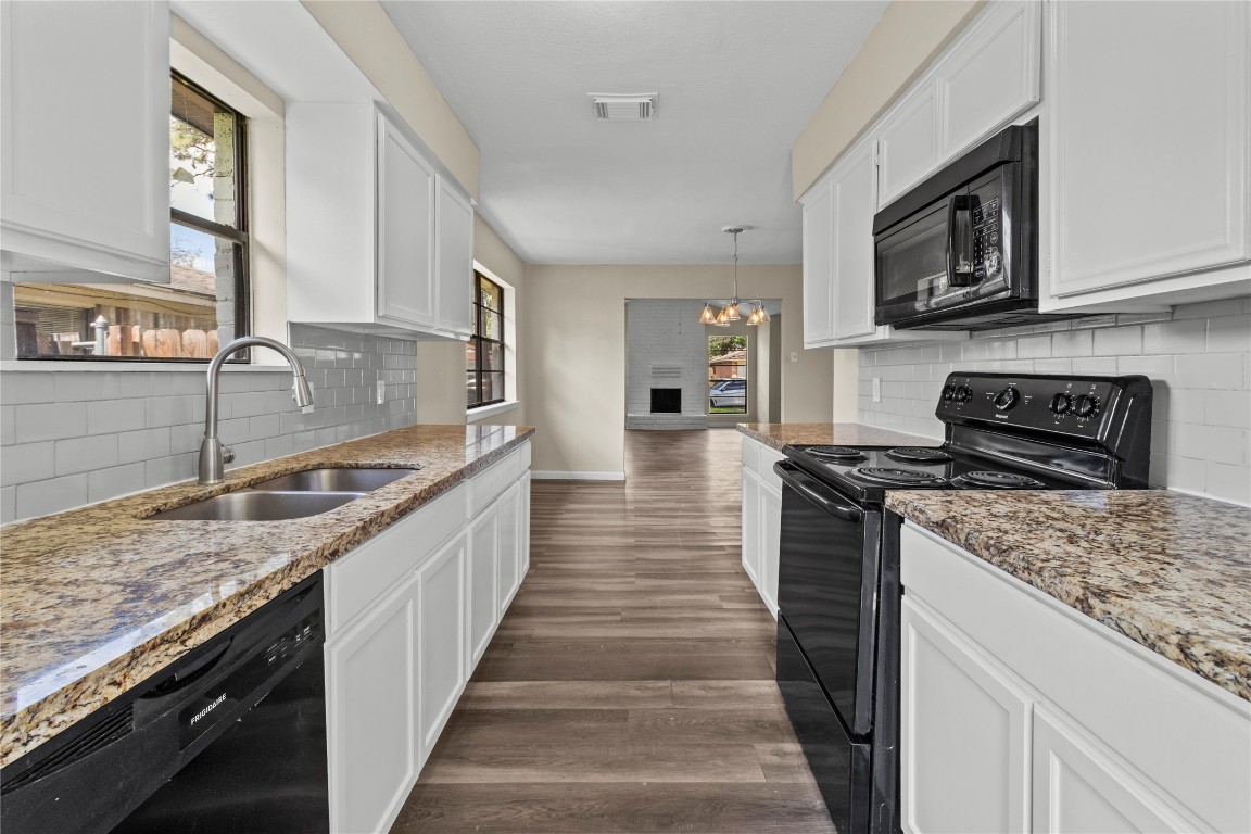 5026 Fitzwater Drive Spring, TX 77373 - Photo 8 of 14 a large kitchen with stainless steel appliances granite countertop a stove and a sink