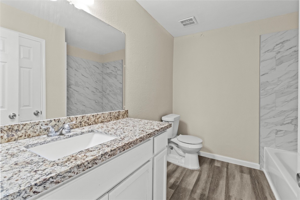 5026 Fitzwater Drive Spring, TX 77373 - Photo 9 of 14 a bathroom with a sink and a toilet
