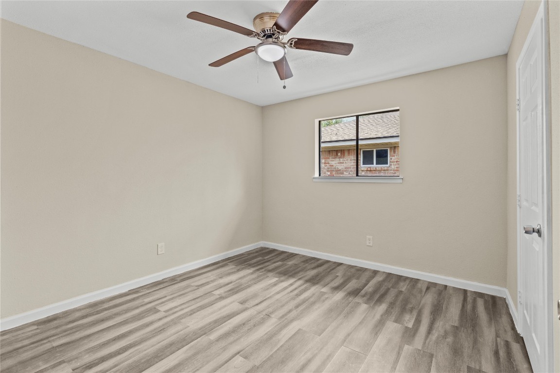 5026 Fitzwater Drive Spring, TX 77373 - Photo 10 of 14 an empty room with a window and a fan