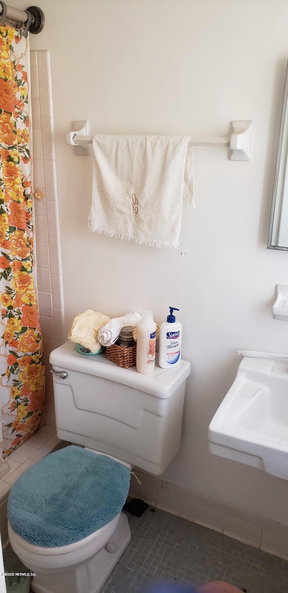 1040 Player Road Jacksonville, FL 32218 - Photo 2 of 12 a bathroom with a sink and a toilet