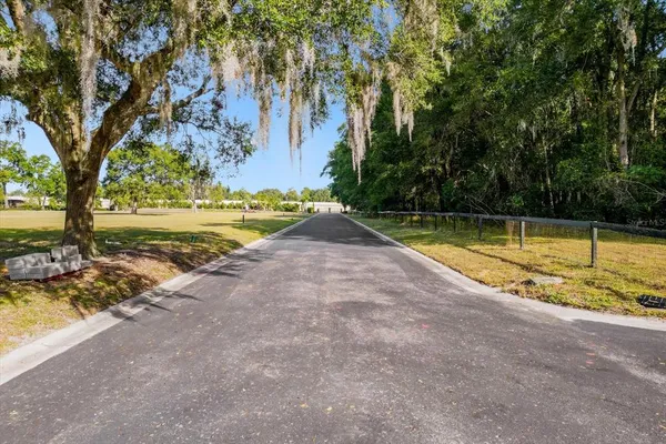 a view of a swimming pool with a yard