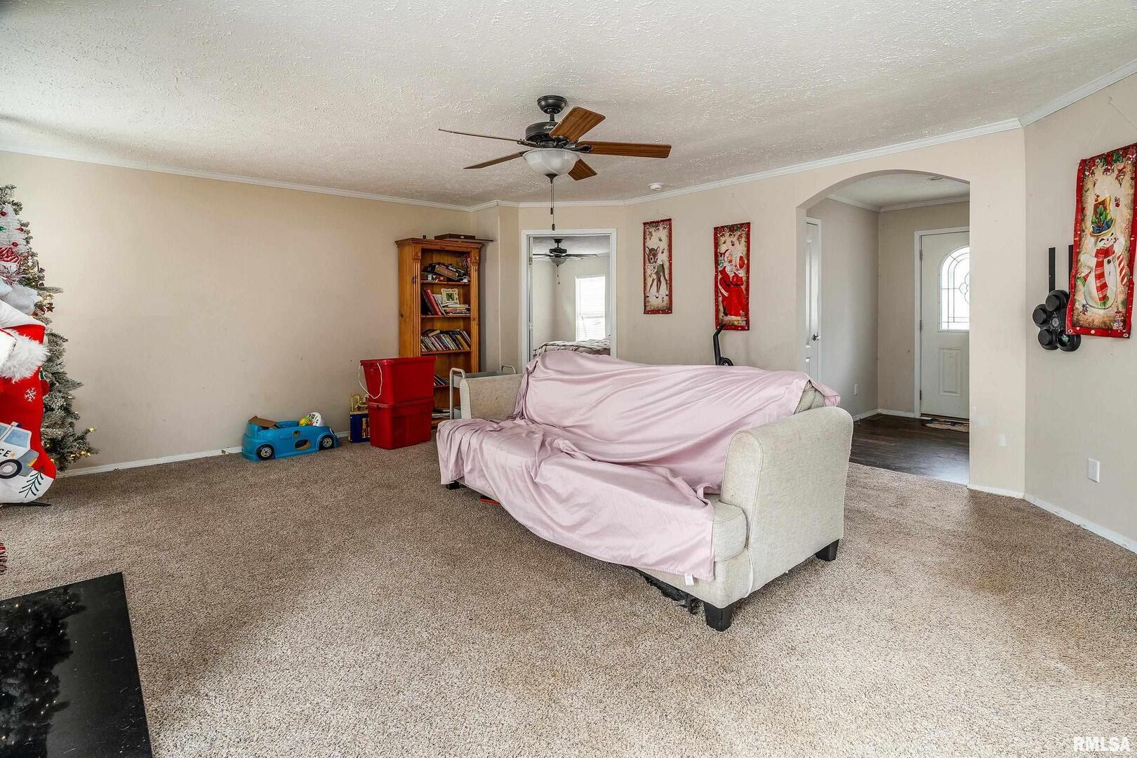 1201 Pine Ridge Lane Makanda, IL 62958 - Photo 13 of 36 a spacious bedroom with a bed chandelier and a window