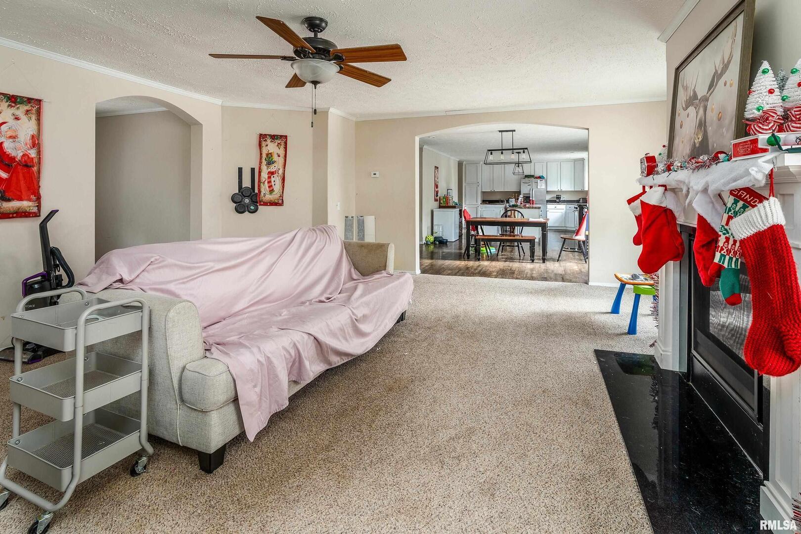 1201 Pine Ridge Lane Makanda, IL 62958 - Photo 14 of 36 a spacious bedroom with a bed and a chandelier