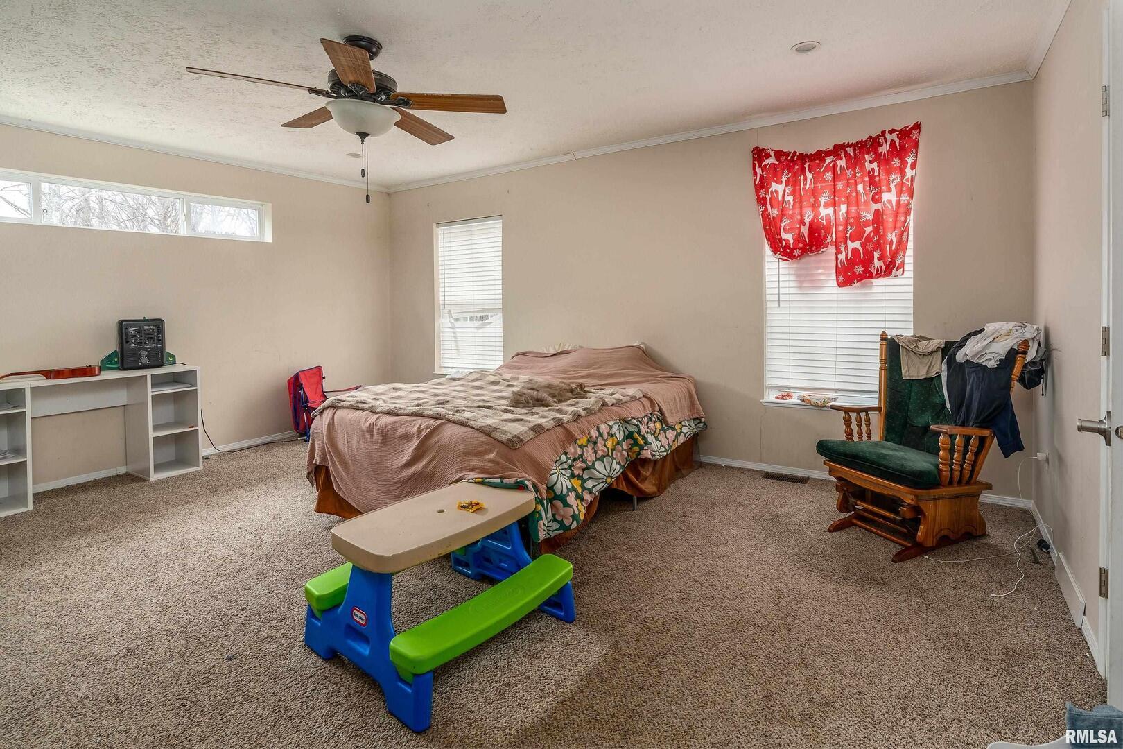 1201 Pine Ridge Lane Makanda, IL 62958 - Photo 21 of 36 a bedroom with bed and a chandelier