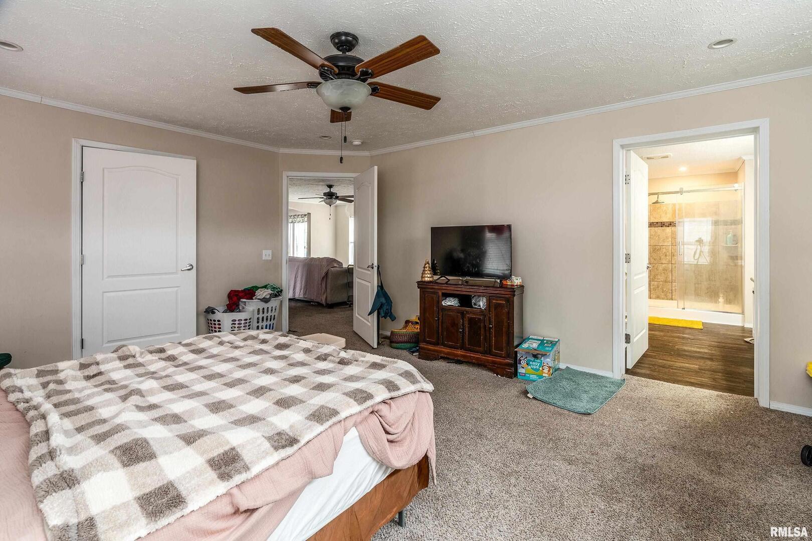 1201 Pine Ridge Lane Makanda, IL 62958 - Photo 23 of 36 a bedroom with a bed and a tv on dresser