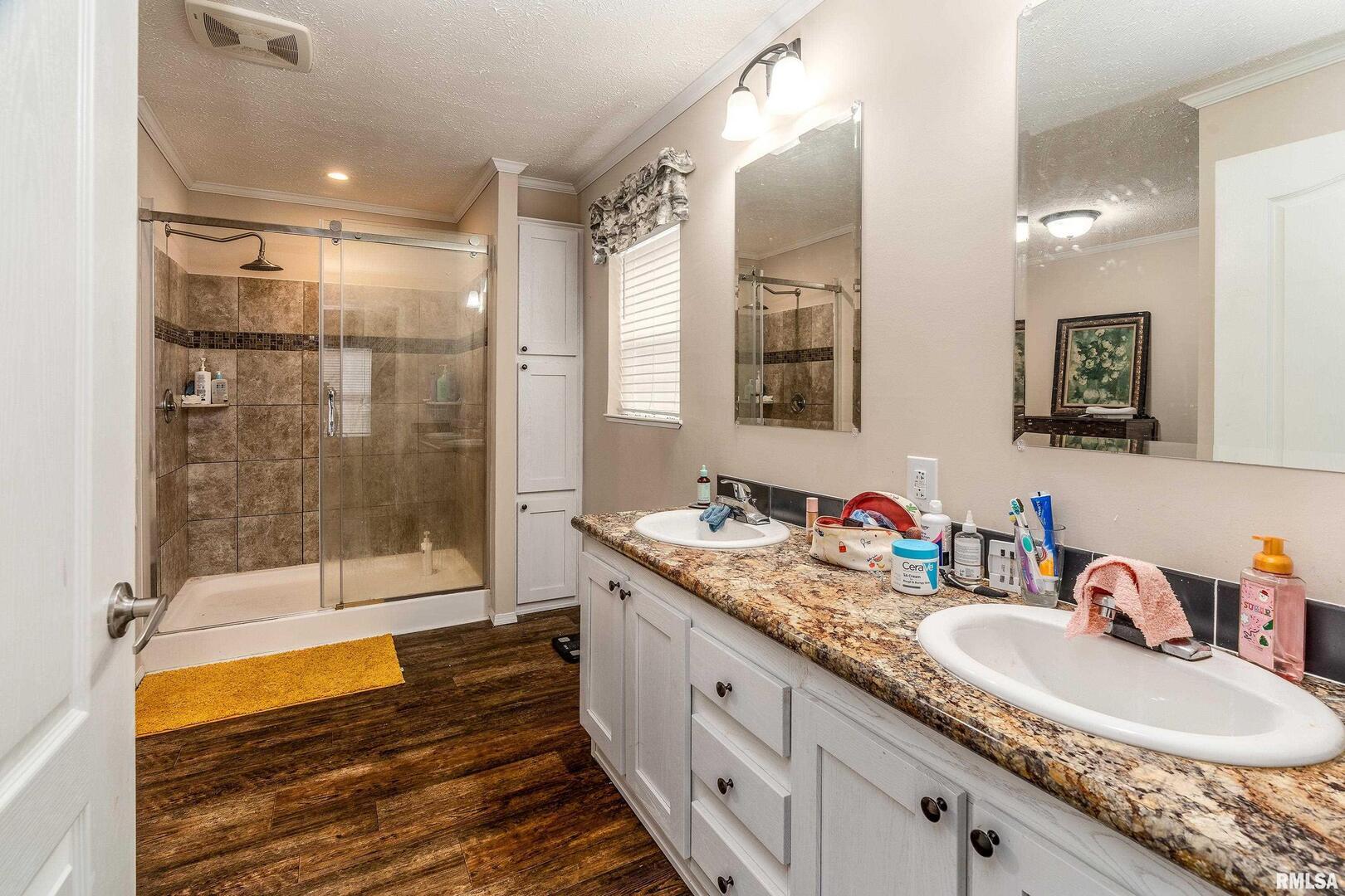 1201 Pine Ridge Lane Makanda, IL 62958 - Photo 24 of 36 a bathroom with a granite countertop sink mirror and shower