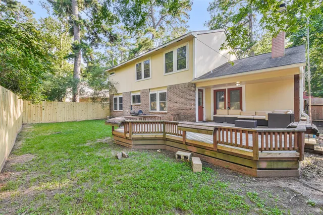 a wooden bench sitting in front of a house