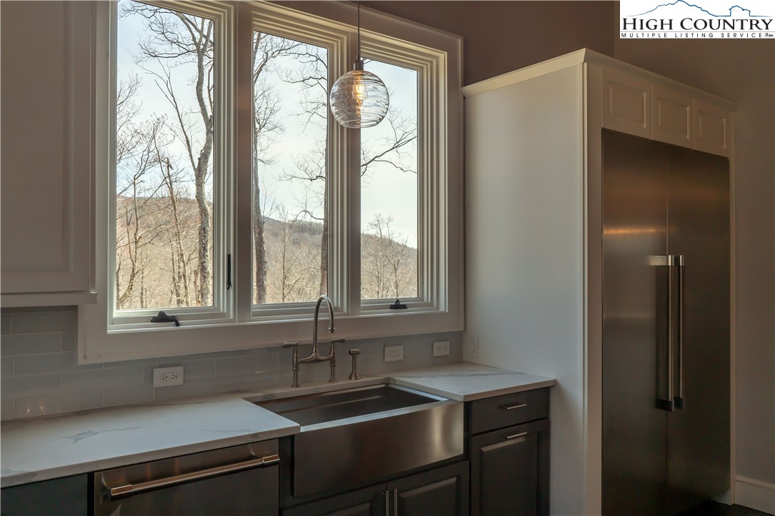 280 Boulder Cay Road Boone, NC 28607 - Photo 14 of 33 a kitchen with a sink and a window