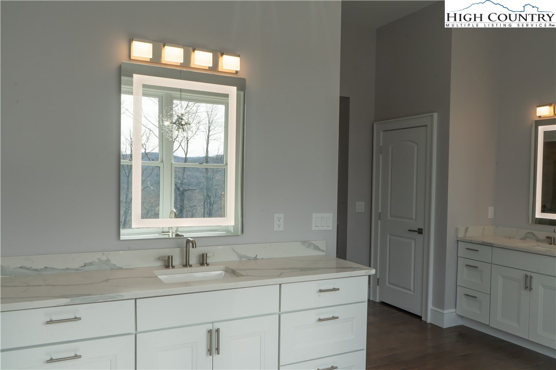 280 Boulder Cay Road Boone, NC 28607 - Photo 21 of 33 a bathroom with a sink and a window
