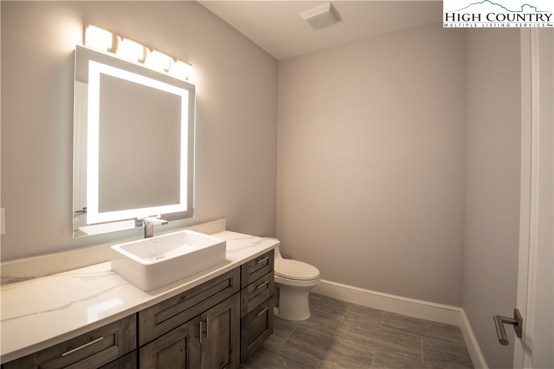 280 Boulder Cay Road Boone, NC 28607 - Photo 24 of 33 a bathroom with a sink and a mirror