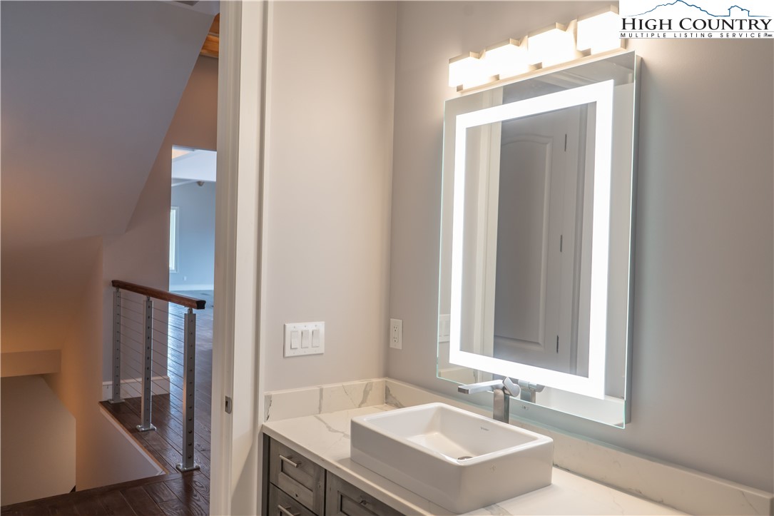 280 Boulder Cay Road Boone, NC 28607 - Photo 25 of 33 a bathroom with a sink and a mirror