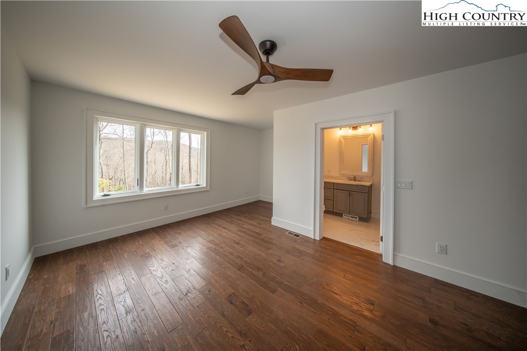 280 Boulder Cay Road Boone, NC 28607 - Photo 27 of 33 a view of empty room with wooden floor and fan