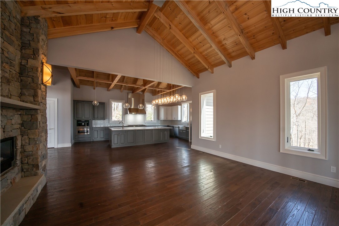 280 Boulder Cay Road Boone, NC 28607 - Photo 8 of 33 a view of a livingroom with wooden floor a fireplace and window