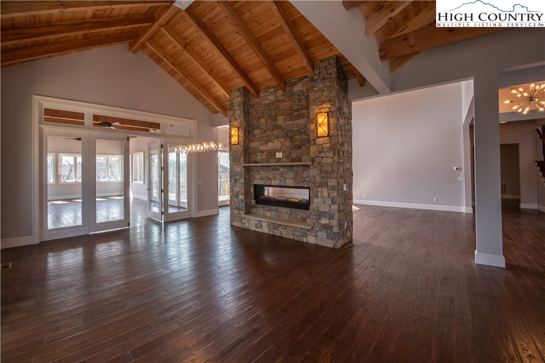 280 Boulder Cay Road Boone, NC 28607 - Photo 10 of 33 a view of a livingroom with wooden floor and a fireplace
