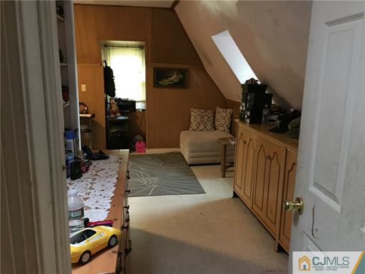 333 New Market Road Dunellen, NJ 08812 - Photo 14 of 19 a bedroom with bed and wooden floor