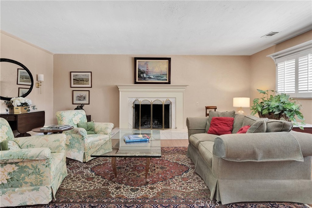 19955 Chickasaw Road Apple Valley, CA 92307 - Photo 10 of 60 a living room with furniture and a fireplace
