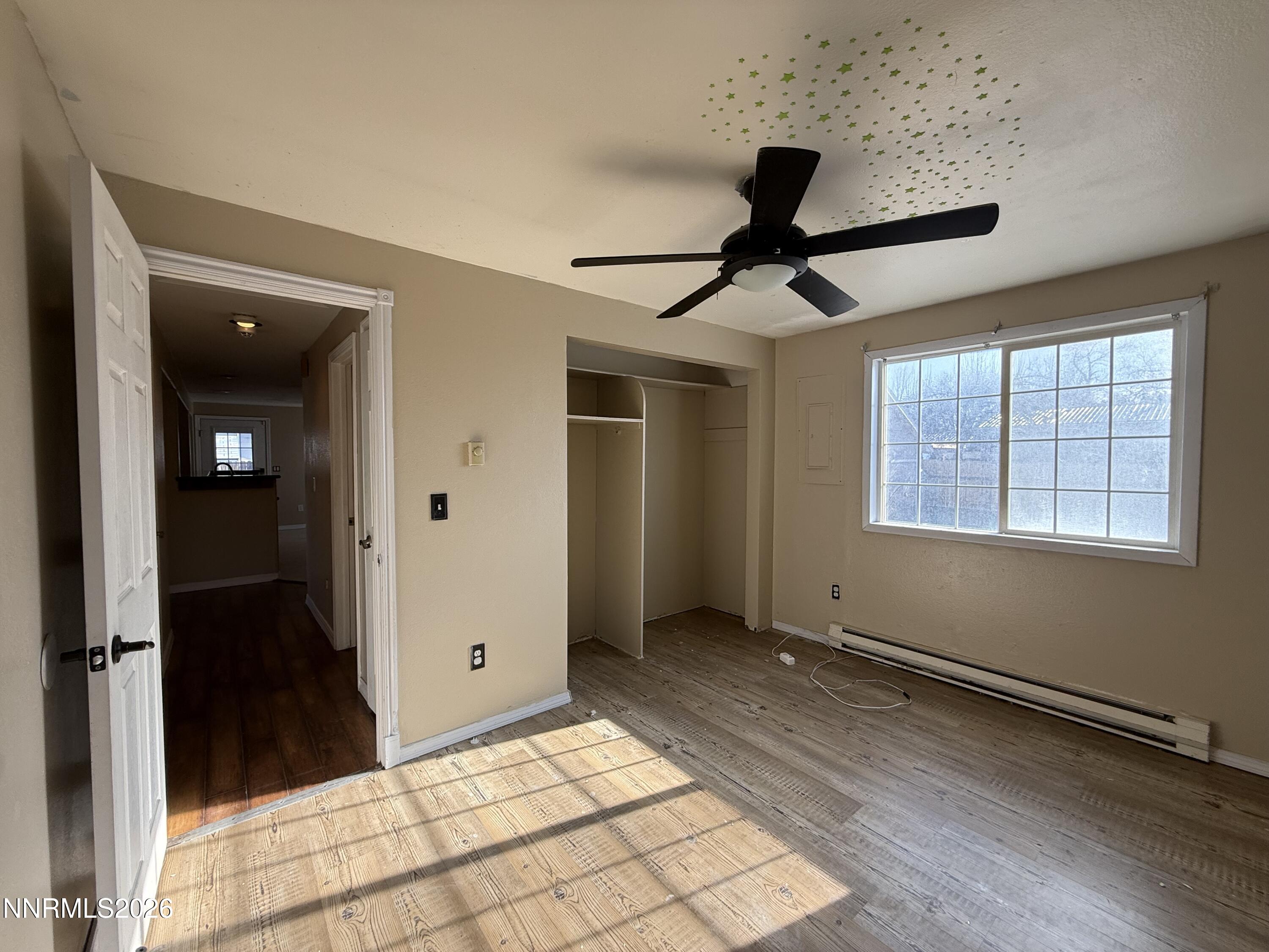 1362 Kodac Street Winnemucca, NV 89445 - Photo 12 of 21 wooden floor in an empty room with a window