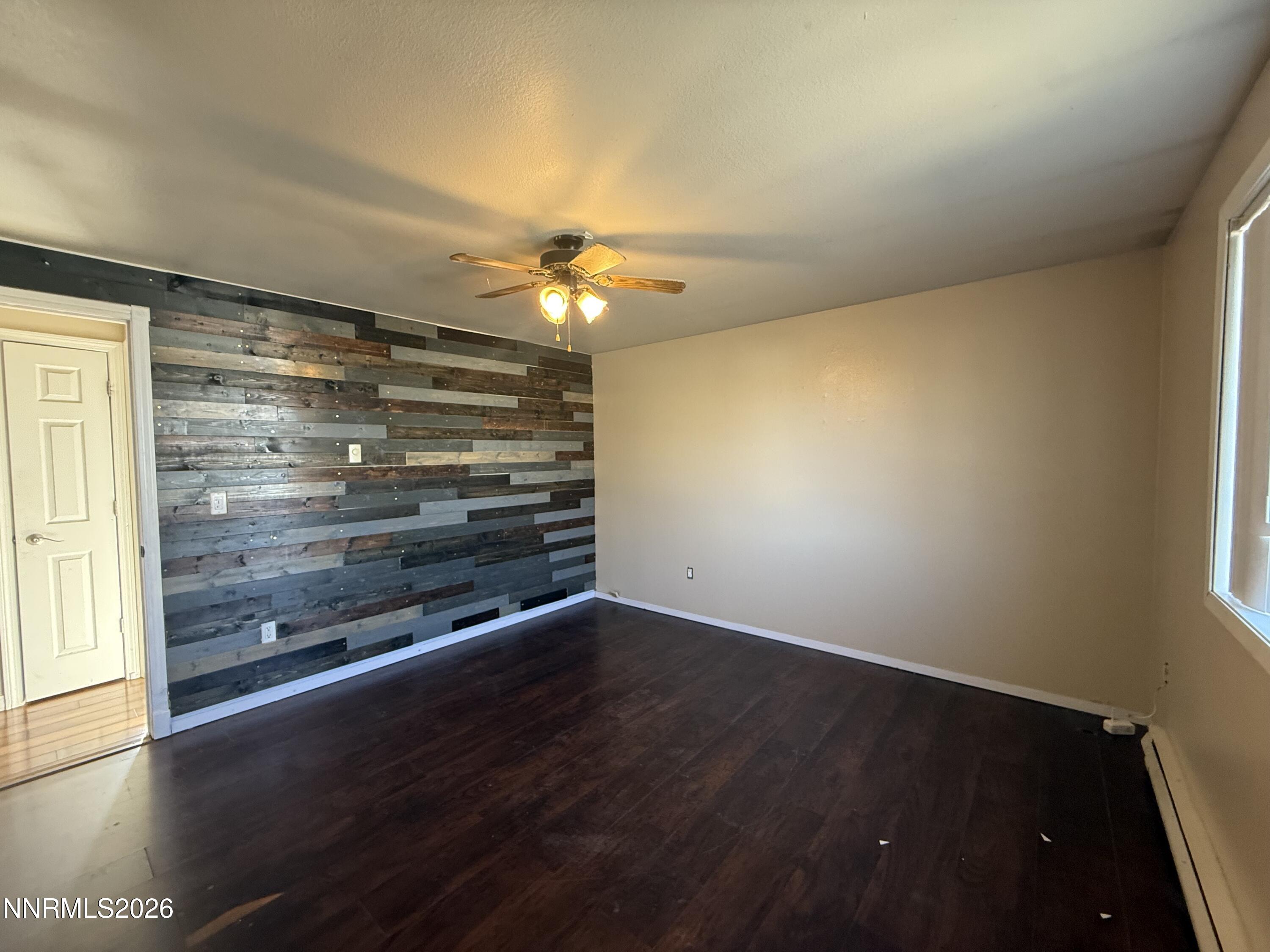 1362 Kodac Street Winnemucca, NV 89445 - Photo 14 of 21 wooden floor in an empty room with a window
