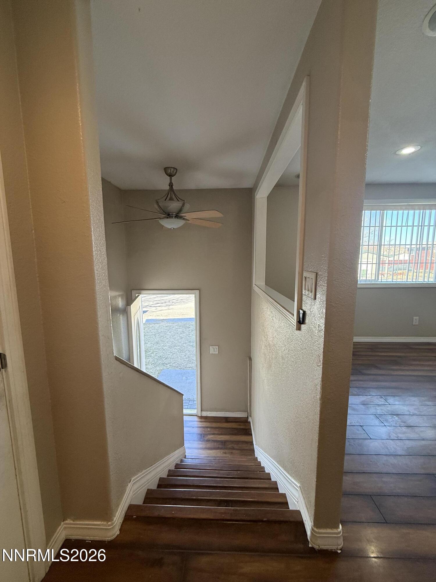1362 Kodac Street Winnemucca, NV 89445 - Photo 19 of 21 a view of a hallway view with wooden floor and staircase