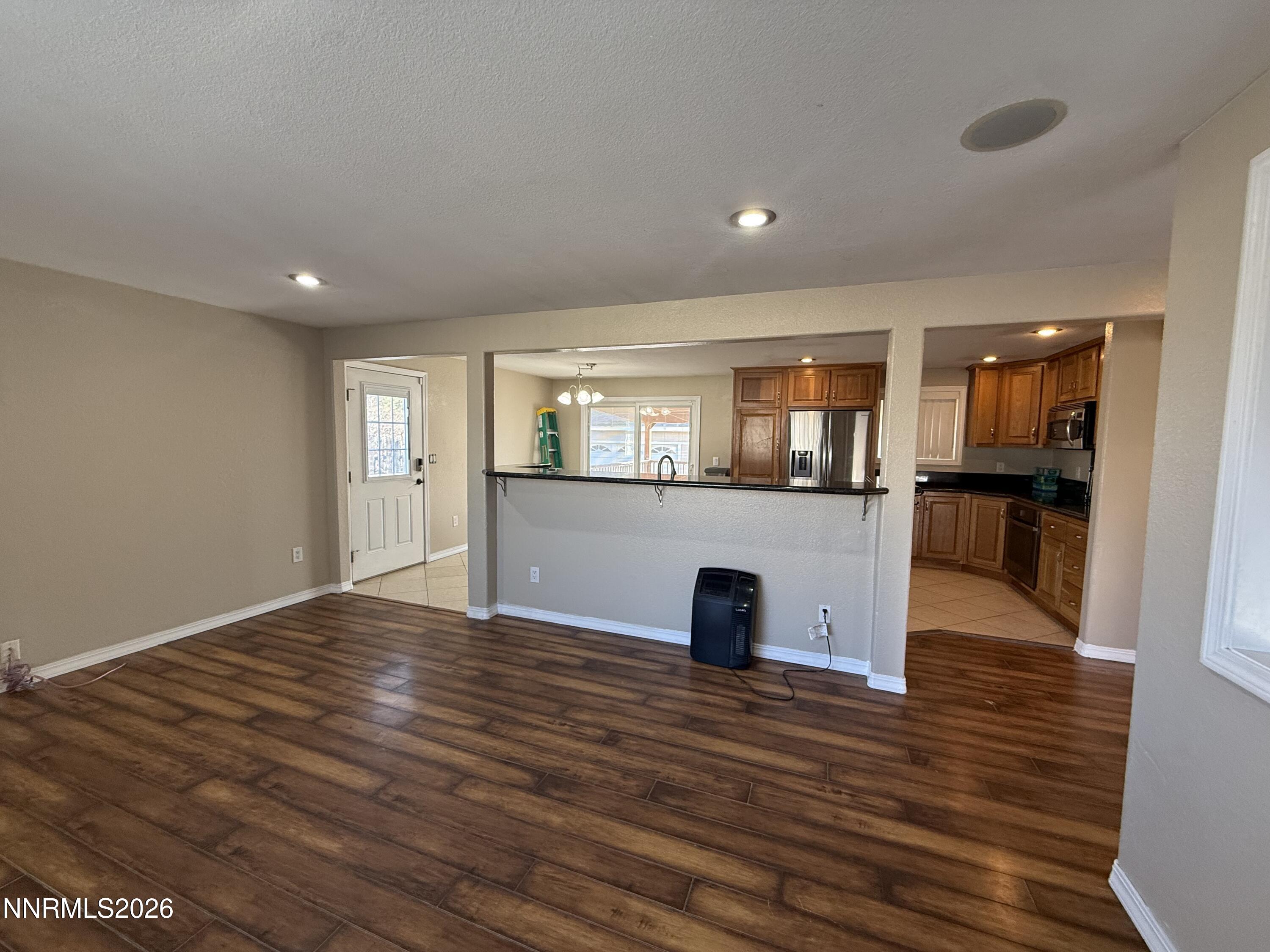 1362 Kodac Street Winnemucca, NV 89445 - Photo 5 of 21 a view of kitchen and hall with wooden floor