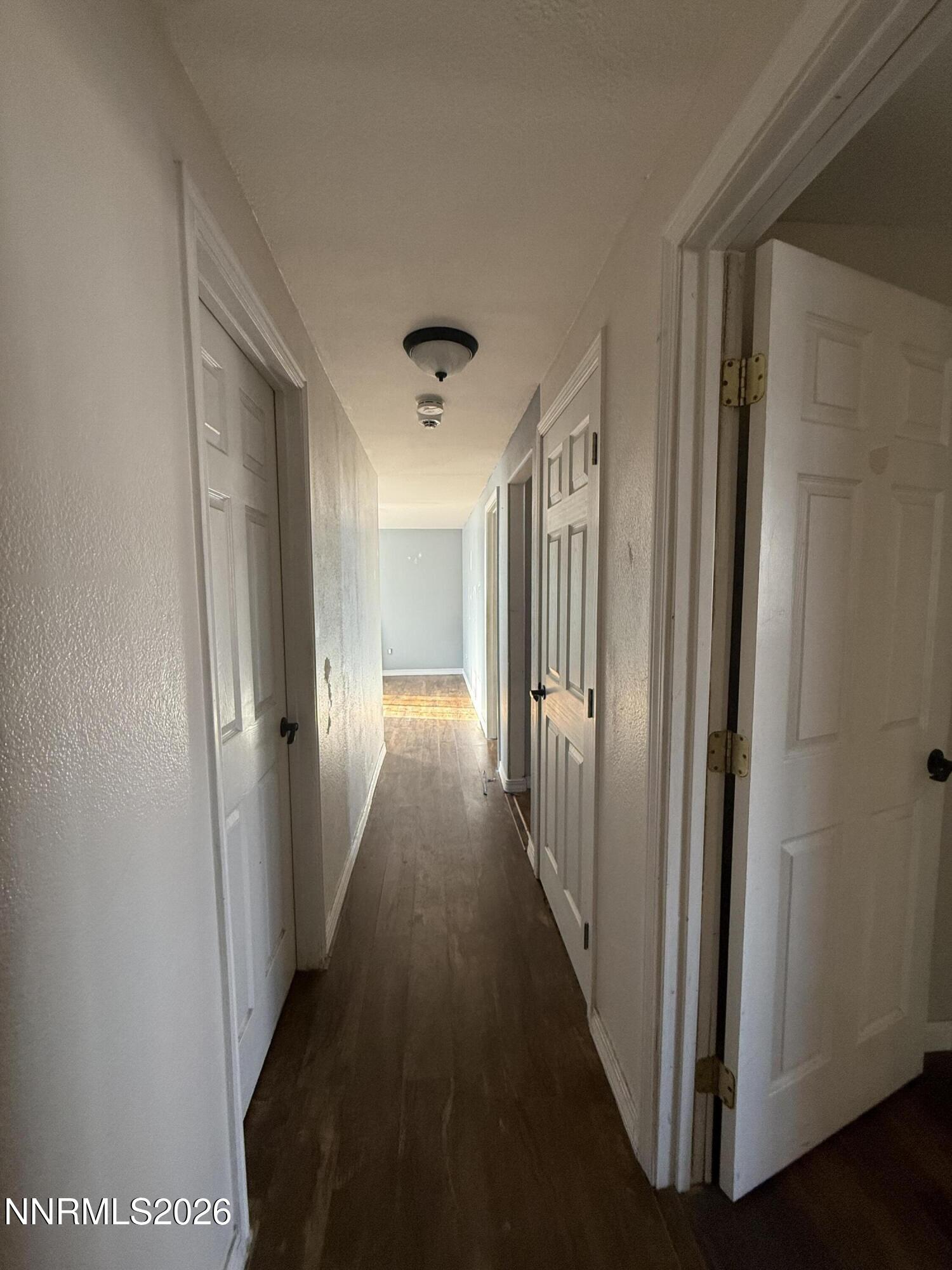 1362 Kodac Street Winnemucca, NV 89445 - Photo 10 of 21 a view of a hallway with wooden floor