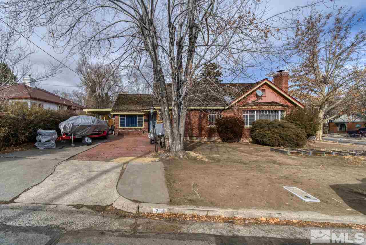 701 West Pueblo Street Reno, NV 89509 - Photo 1 of 30 a front view of a house with a yard and garage