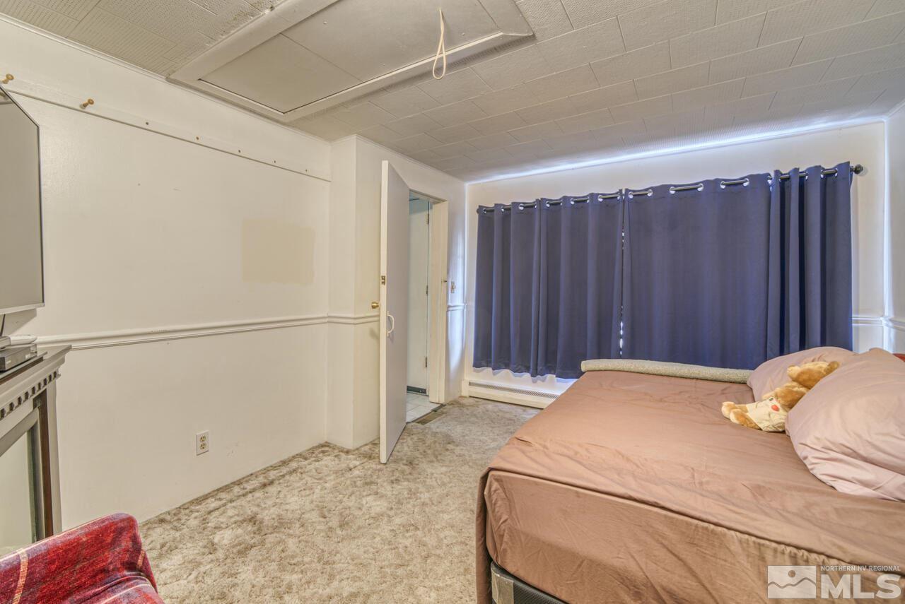 701 West Pueblo Street Reno, NV 89509 - Photo 17 of 30 a bedroom with a bed and a cabinet