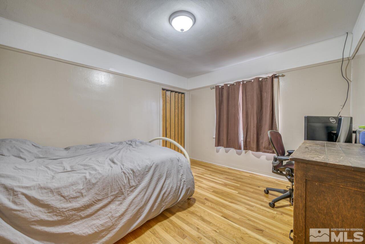 701 West Pueblo Street Reno, NV 89509 - Photo 23 of 30 a bedroom with a bed and a flat screen tv